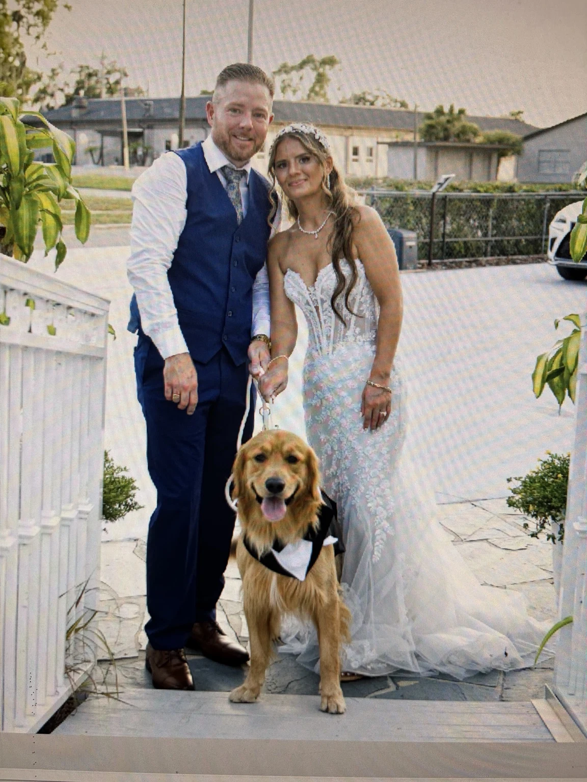 Sean and Evelyn with their dog Kazimir on their wedding day.